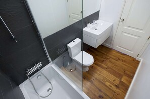 Bathroom with bathtub and shower