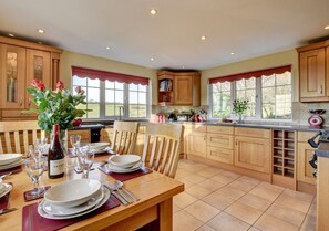 The immaculate fitted dining kitchen is light and bright