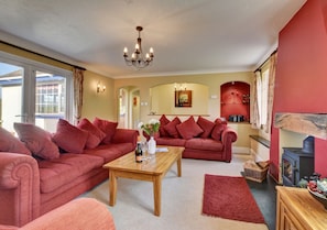 Spacious sitting room which leads out onto the patio