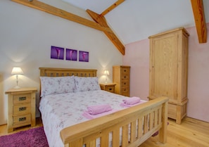 The double bedroom is on the mezzanine floor and has an ensuite shower room, WC and basin