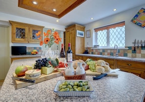 The large kitchen is extremely well equipped and has plenty of space for preparing family meals