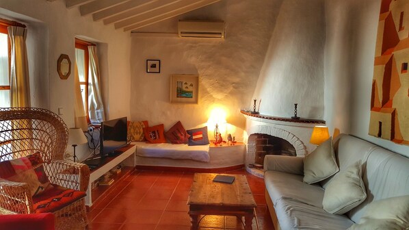 Living room with fire place
Views to private Patio & Splash Pool.