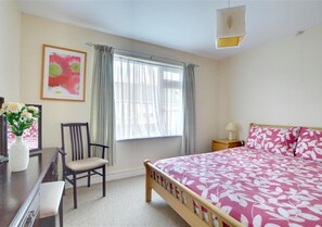 Attractive master bedroom with kingsize bed