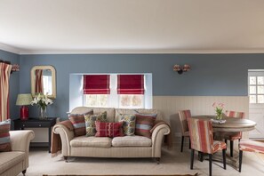 The Mill House - sitting room with two double sofas
