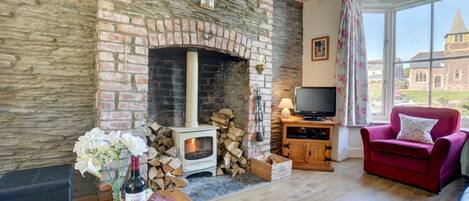 The woodburner makes the sitting room extremely cosy on cooler evenings