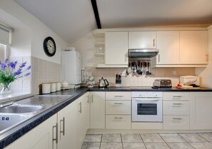 There is a step down from the sitting room into the Kitchen.