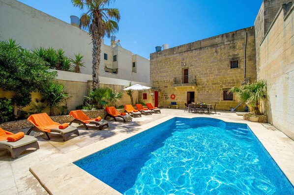 Pool area of Ponderosa holiday farmhouse in Gozo, Malta