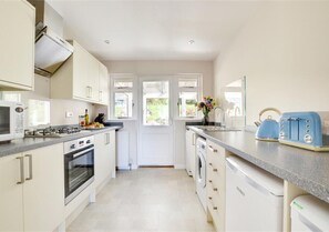 A newly fitted and well equipped kitchen at the rear of the property leads into a small conservatory great for quiet relaxation