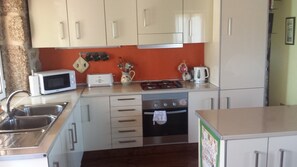 Your modern fully-kitted kitchen with fridge freezer and island cupboards