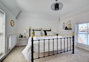 Bedroom 1 with super king size bed and bedside tables 