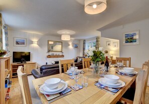 The large dining table is perfect for family meals together