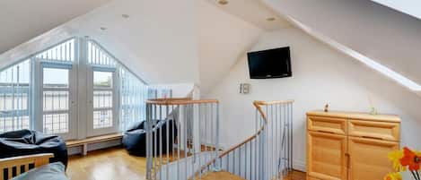 Mezzanine lounge in modern St Ives holiday flat