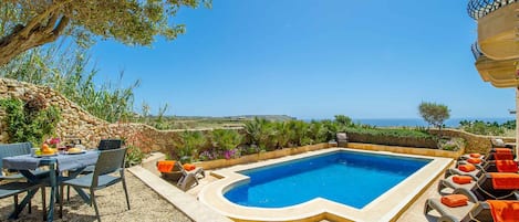 Pool area of Dar il-Bahar holiday home in Gozo