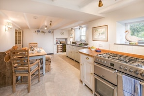 Abbey House - the bright kitchen with breakfast dining space - please note the cooker is now electric with a ceramic hob