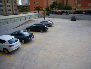 Common parking area, not guaranteed parking place for every apartment