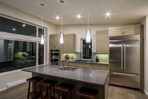 modern built in convection oven and microwave, dishwasher and bar seating for 4.