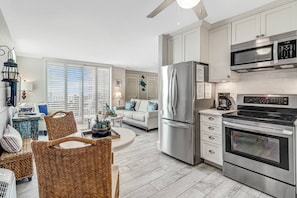 The studio layout allows an unobstructed view of the gulf while lounging, dining or preparing meals in the kitchen.