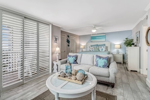 Custom plantation shutters allow you to control the amount of light and privacy and provide a full view of the gulf from the living room.