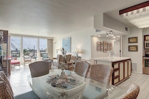 Indoor - Dining area, island, and beautiful window view from living area