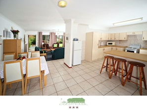 Open plan Kitchen, living room and dining area.