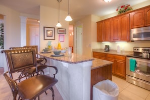 Immerse Yourself in the Charm of a Kitchen Adorned with Timeless Rustic Furnishings.