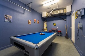 Converted garage showing pool table and seating