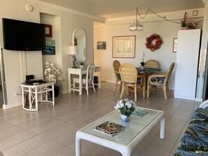 Dining  & living room with comfortable Tropical Furnishings Flat Screen TV  & high speed internet.