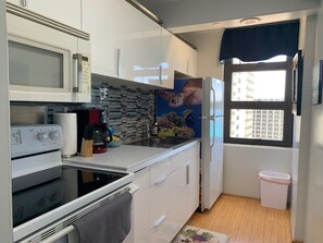 Full Kitchen with everything you need to create & serve your meals,  just like home.