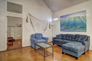Living room - Coastal living room with charming fishing net decor