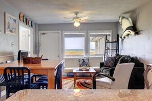 Open dining and living area with beautiful views. - Open dining and living area with beautiful views.