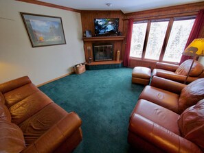 Living Room Area - Super comfortable living room with an incredible view, cozy fireplace, and TV.