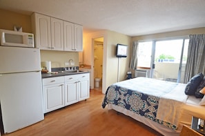 Kitchenette has a sink, refrigerator, microwave, coffee pot, tea kettle & a hot plate for lite cooking.