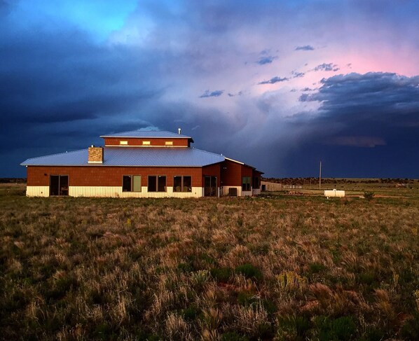 west facing, guest house includes the sliding doors on the left of the house