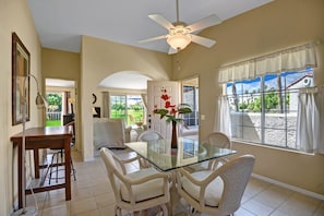 K0452 - 05 - DINING ROOM REVERSE - Oranj Palm Vacation Homes.jpg