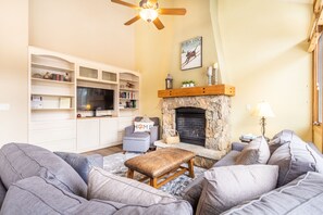 Living area w/ large flat screen smart TV.