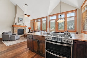 Full size kitchen featuring granite countertops and stainless steel appliances