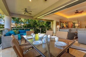 Seamless indoor/outdoor access to the lanai and living room. .