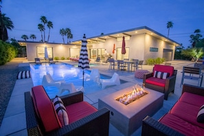 Relax by the Fire Pit after a Day of Poolside Lounging or Barbecue on the Oversized Grill