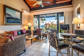 Spacious living and dining area with vaulted ceilings and ocean views!