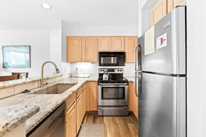 Private kitchen with updated granite countertops.