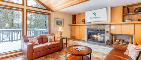 Living Room w/ Wood Fireplace and TV