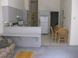 from the front room looking into the kitchen area.