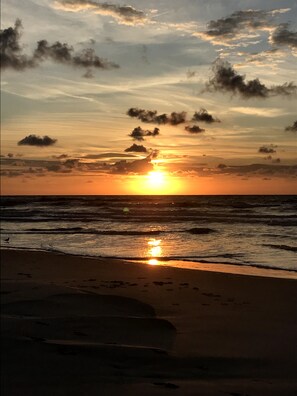 AN EARLY MORNING SUNRISE ILLUMINATES YOUR 
PRIVATE  BEACH