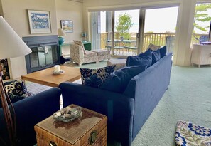 Entrance to living room with expansive view of Lake Michigan and beach