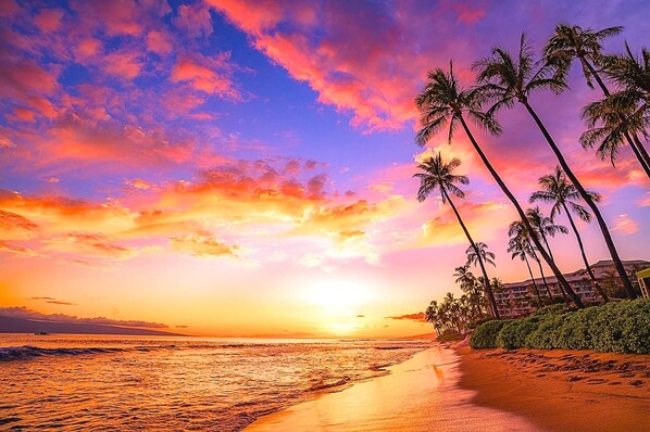 Sunset spills fire over waves in stunning tropical brilliance. KRO-Q102