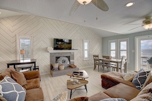 Open living room with views - Romantic fireplace and TV for entertainment