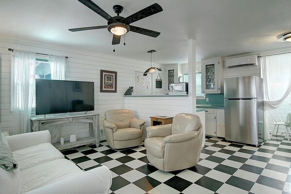 Living room - Cozy living area with large TV and open floor plan