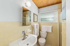 Renovated Bathrooms with New Toilet, Vanity, and Tile