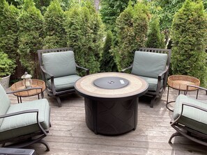 Cozy spot on the front deck with propane fireplace
