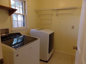 Fully furnished laundry. Iron and Ironing pad Washer and Dryer. Beginning pods.